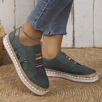 Women's blue denim sneakers featuring cat embroidery, designed as casual slip-ons.