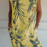 Yellow floral knee-length dress for women, featuring short sleeves and a lightweight summer tunic design.