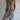 Women's blue floral knee-length summer tunic dress, worn by a model showcasing the dress's lightweight fabric and comfortable fit, with focus on the one-piece garment design, arm and shoulder details, and knee-length hem.