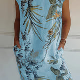 Women's lightweight summer tunic dress in Azzurro, featuring a blue floral pattern, knee-length design, and short sleeves.