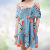 Women's blue floral off-shoulder summer mini dress in XL size, featuring a vibrant floral pattern against a white background. The dress is a one-piece garment with an off-the-shoulder design, perfect for warm weather outings.