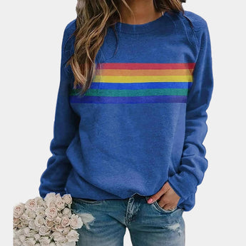 
A women's blue sweatshirt featuring rainbow stripes across the chest, with a crew neck and long sleeves, shown in size 3XL.