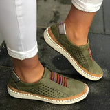 Women's green suede slip-on sneakers in size 43, featuring a comfortable perforated design suitable for walking.