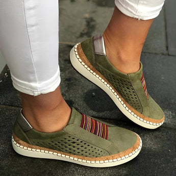 Women's green suede slip-on sneakers in size 43, featuring a comfortable perforated design suitable for walking.