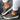 Women's blue suede slip-on sneakers in size 43, featuring a comfortable and perforated design ideal for walking. The shoes are shown against a contrasting background, highlighting their sporty and stylish appearance.