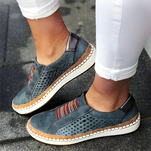 Women's blue suede slip-on sneakers in size 43, featuring a comfortable and perforated design ideal for walking. The shoes are shown against a contrasting background, highlighting their sporty and stylish appearance.