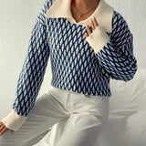 Women's blue and white houndstooth crewneck sweater featuring a retro knitwear design with long sleeves.