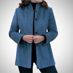 Elegant women's blue wool coat with a tailored fit, featuring a classic collar and long sleeves in a sea blue color, designed for winter wear.