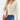 Blush pink cable knit turtleneck sweater for women in a cozy fall fashion style, featuring long sleeves and a comfortable fit in apricot color, size 2XL.