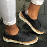 Women's breathable slip-on sneakers in black leather, featuring a casual design with comfortable joint support, shown in size 43.