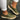Women's breathable slip-on sneakers in green leather, size 43, shown in a casual setting highlighting comfort and fashion.