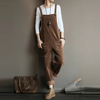 Women's brown corduroy overalls in a vintage style, featuring adjustable straps and designed as a jumpsuit. The overalls are in a coffee color and come in size 5XL. The fabric gives a textured look, and the outfit complements the shoulders and waist.