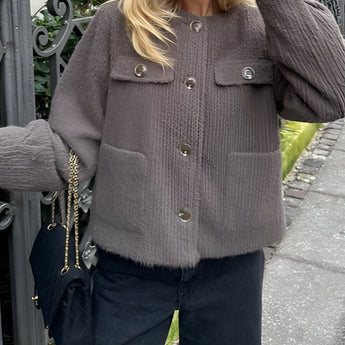 Brown corduroy oversized jacket for women featuring a trendy casual urban style, with plaid detailing on the fabric, long sleeves, and a relaxed fit.