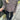 
A woman wearing an oversized brown corduroy jacket styled in a trendy casual urban fashion. The jacket features long sleeves and a relaxed fit, perfect for a comfortable yet stylish look.