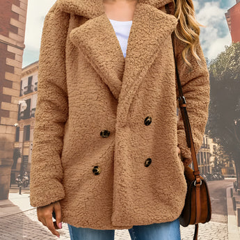 
A women's brown teddy coat in a camel color, featuring a warm double-breasted design with fleece material. The coat is displayed against a contrasting background, showcasing its long sleeves, structured collar, and cozy texture. The coat is designed in a 2XL size for a comfortable fit.