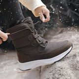 Women's brown waterproof insulated high-top snow boots displayed outdoors, showcasing their stylish design suitable for winter weather.
