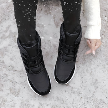Stylish high-top women's snow boots in brown, featuring a waterproof and insulated design, perfect for winter weather.