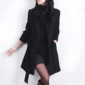 Women's brown wool double-breasted trench coat featuring a stylish design, suitable for winter wear. The coat has a classic trench coat style with a well-defined shoulder and waist, reaching knee length.