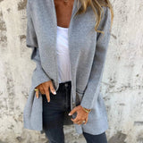 Women's camel coat made of lightweight wool, featuring a casual chic design perfect for fall. The coat has a structured collar, long sleeves, and a tailored fit around the waist, blending elegance with comfort. The neutral hue complements a variety of outfits, adding versatility to wardrobe choices.