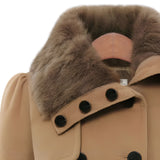 Women's camel skater coat featuring a fur collar, belted waist, and flared design, ideal for winter fashion. The coat is predominantly beige with fur detailing for added warmth and style.