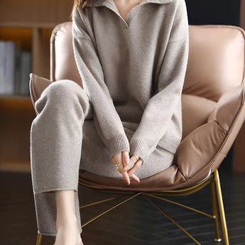 Luxurious beige women's cashmere sweater and pants loungewear set featuring a comfortable fit with long sleeves, a relaxed collar, and a tailored waist, perfect for lounging or casual outings.