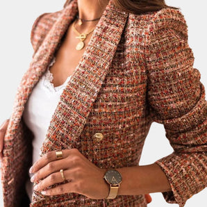 Women's multicolor tweed blazer with gold detailing, featuring a chic design. The blazer has long sleeves and a structured fit, showcasing a classic tartan pattern.
