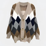 Women's chunky knit houndstooth oversized cardigan sweater in khaki, featuring a cozy and textured design with an open front and long sleeves.