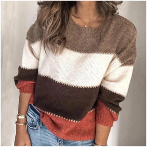 Women's color-block knit sweater with trendy striped pattern, featuring long sleeves and a crew neck design.