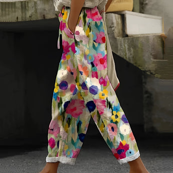 Women's pink bohemian floral wide-leg pants, stylish summer fashion, featuring a colorful design and a comfortable fit for a trendy, casual look.