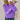 
A woman wearing a cozy purple cable knit sweater in a 3XL size, featuring a textured pattern with long sleeves and a collar.