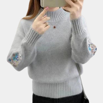 Women's gray cozy floral embroidered sweater in XL size, featuring detailed floral embroidery on the upper sleeve and shoulder area. The sweater has a comfortable round neck and long sleeves, ideal for autumn and winter fashion.