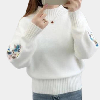 Women's white cozy floral embroidered sweater featuring long sleeves and a round neck, shown in an XL size. Suitable for autumn and winter fashion, the sweater highlights detailed floral embroidery on the fabric.