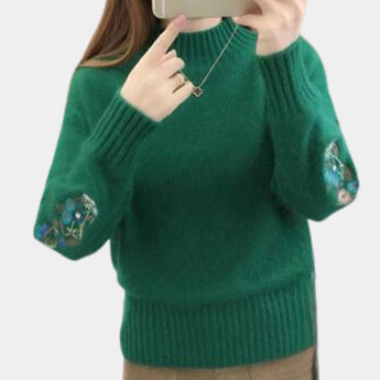 
A green women's cozy floral embroidered sweater in XL size, featuring long sleeves, a round neck, and intricate floral embroidery, ideal for autumn and winter fashion.