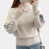 Women's cozy floral embroidered sweater in khaki, size XL, featuring intricate detailing on the shoulder and arm areas, perfect for autumn and winter fashion.