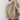 Women's oversized cashmere turtleneck sweater in a khaki color, featuring a loose fit with long sleeves and a high neck design.