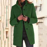 Women's cozy grey wool mid-length winter coat featuring a notch lapel and three-button design, shown in a standing pose highlighting the shoulder and sleeve details.