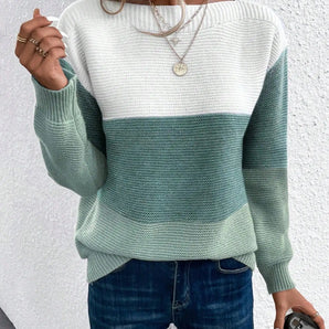 Women's green and white striped cozy knit sweater, relaxed fit, modeled in an XL size, paired with jeans.