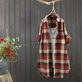 Women's Cozy Plaid Linen Dress in autumn vintage style, displayed on a clothes hanger against a neutral background, featuring a tartan pattern with long sleeves and a midi length.