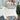 Women's cozy winter sweater in white featuring reindeer and snowflake knit patterns, shown in an XL size. The sweater includes long sleeves and a round neckline, highlighting a mix of black and white textile design.