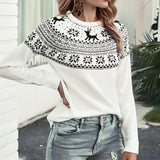 Women's cozy winter sweater featuring a white reindeer and snowflake knit pattern, shown in a black and white color scheme. The sweater has long sleeves and a crew neck design, suitable for cold weather outerwear.