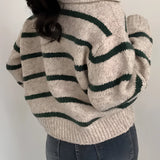 Women's cream and burgundy striped puff sleeve sweater with a round neckline, showcasing autumn knitwear fashion.