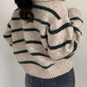Women's cream and burgundy striped puff sleeve sweater with a round neckline, showcasing autumn knitwear fashion.