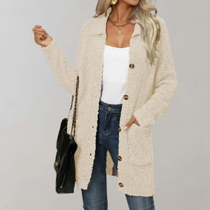 Women's cream mid-length teddy coat in apricot color, featuring plush material and designed for winter wear. The coat has long sleeves and a comfortable fit, suitable for size XL.
