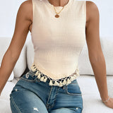 Women's cream ribbed cropped knit top featuring a stylish design with short sleeves and a round neckline, perfect for casual summer fashion.