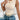 Women's cream ribbed cropped knit top in beige, featuring short sleeves, a round neckline, and a fitted design, perfect for casual chic summer fashion.