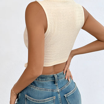 Women's cream ribbed cropped knit top with short sleeves and a crew neckline, showcasing casual chic summer fashion in a soft white hue.