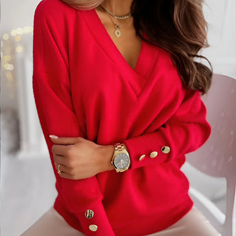 Women's pink sweater with a deep V-neck and button cuffs, suitable for office and casual wear, featuring long sleeves and a comfy knit design.
