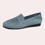 Women's denim flats in electric blue with a stylish chain ankle bracelet, featuring a casual design suitable for outdoor wear.