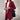 Women's burgundy double-breasted long winter coat with a chic urban style, featuring a trench coat design, wide collar, and long sleeves, suitable for colder weather.