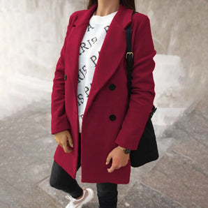 Women's chic urban style double-breasted long red winter coat featuring a tailored fit, prominent collar, full-length sleeves, and waist detailing.
